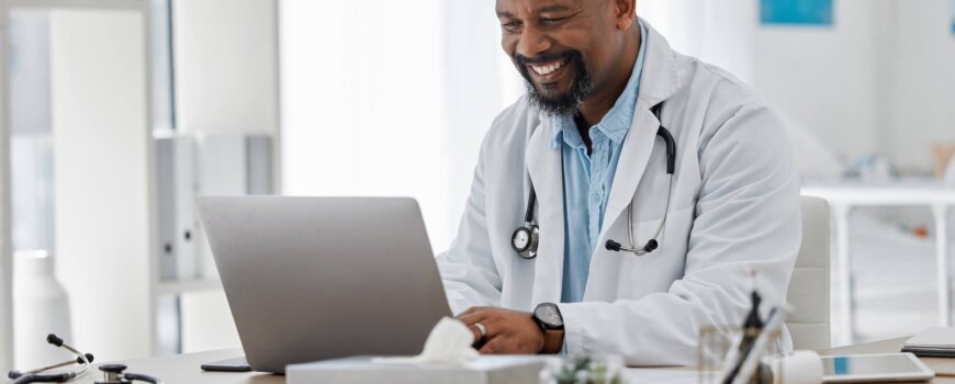 Doctor,,Medical,And,Healthcare,Worker,On,Laptop,Checking,History,Or